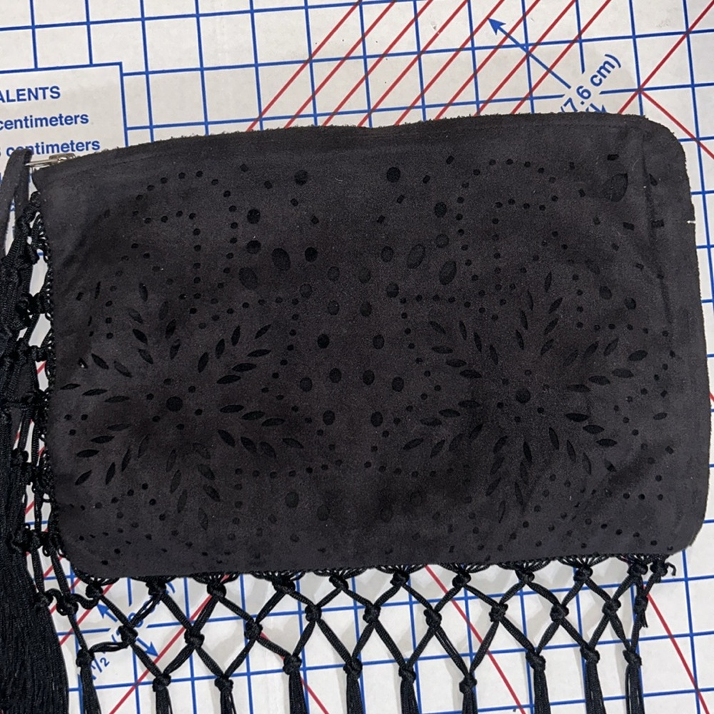 That’s iT wristlet with cut out star flower pattern